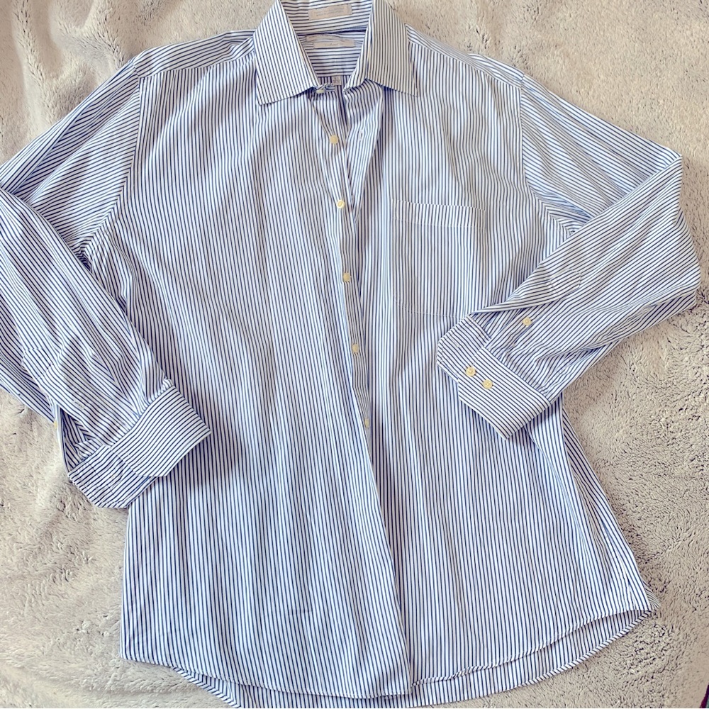 Oversized collared blue and white striped button down shirt. Women’s large.